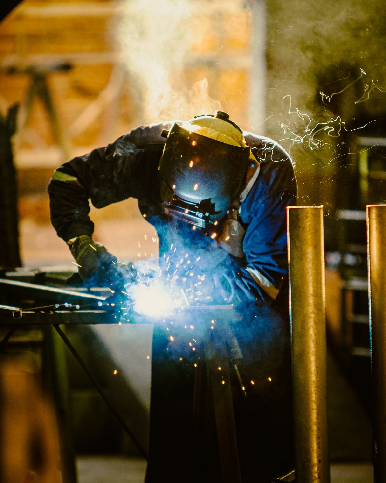 Welder in a steel fabrication workshop