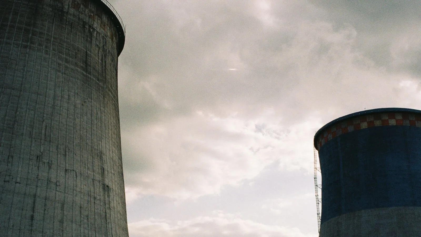 Cooling towers of a nuclear power station under a cloudy sky