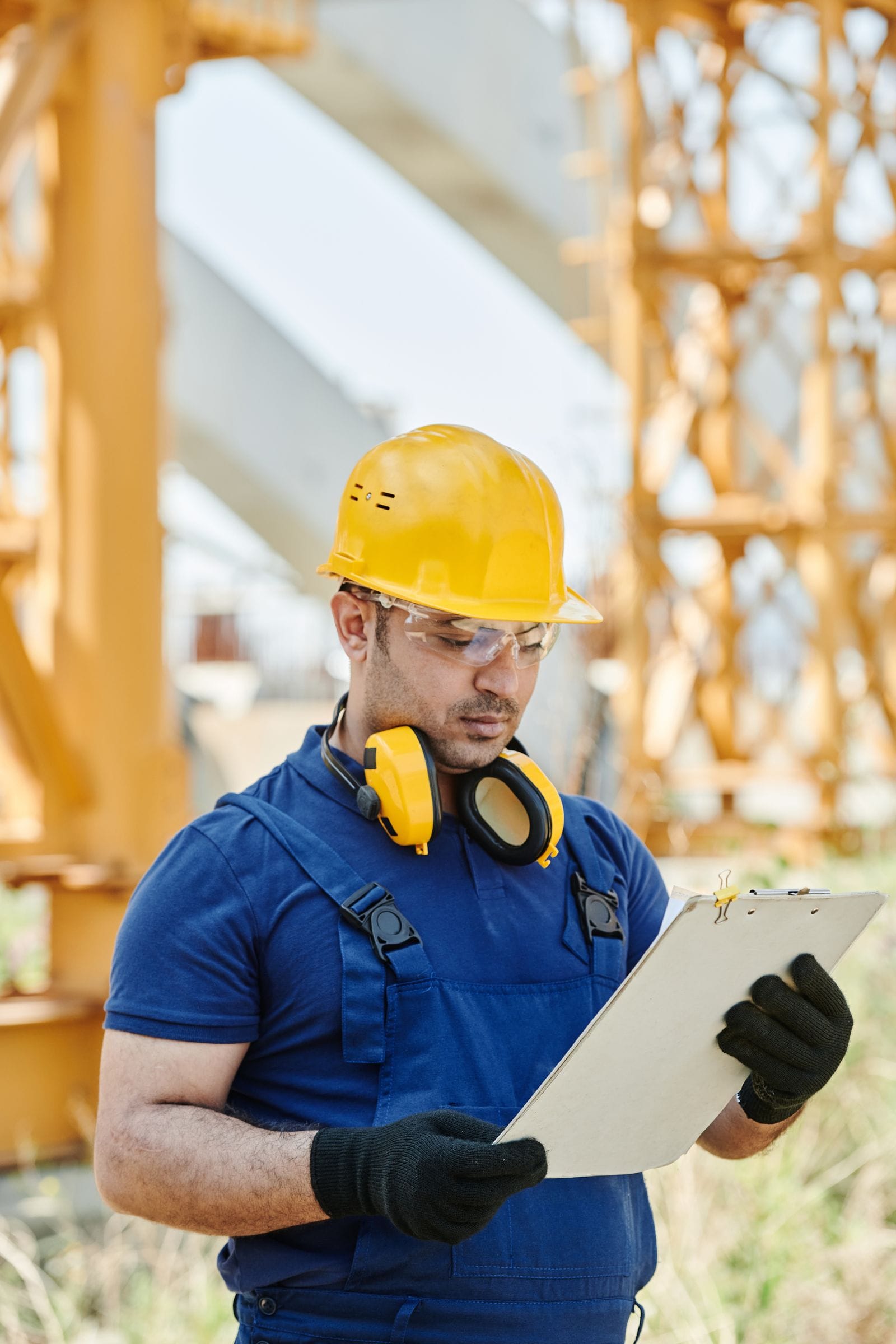 Engineer reviewing inspection documents on site