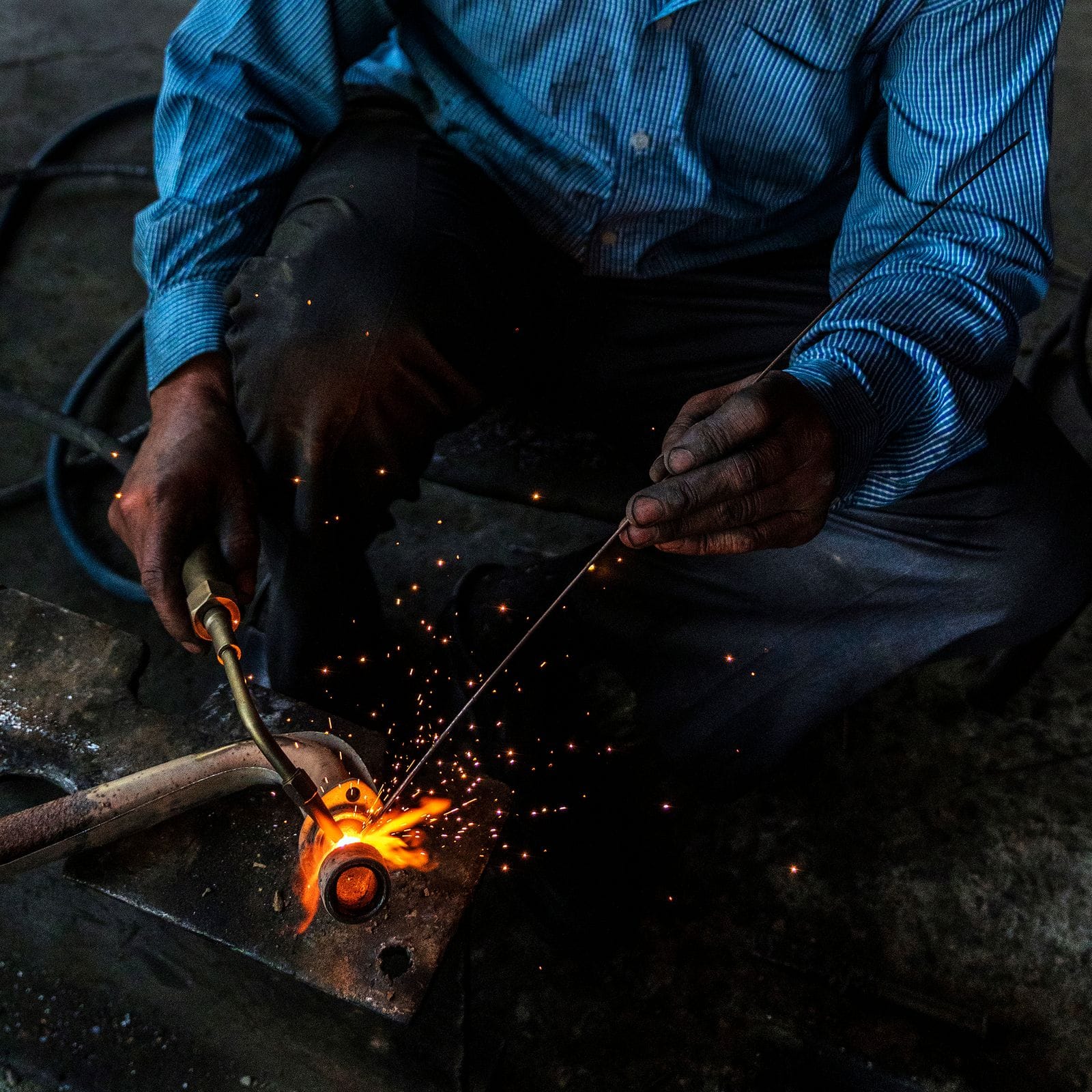 Welder joining a steel pipe